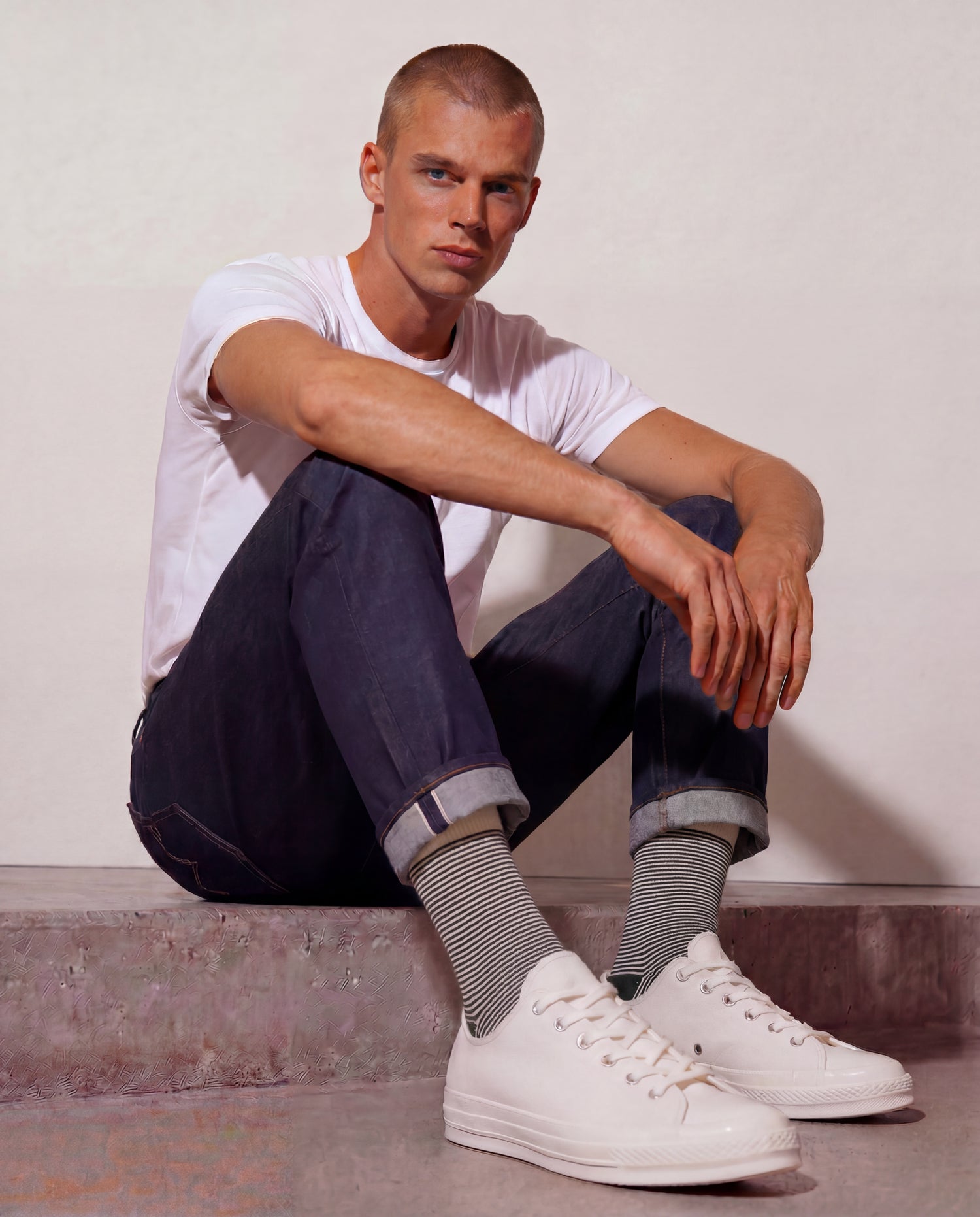 Forest green and off-white striped socks worn with rolled raw denim and off-white canvas sneakers — Democratique Socks Ultralight Stripes