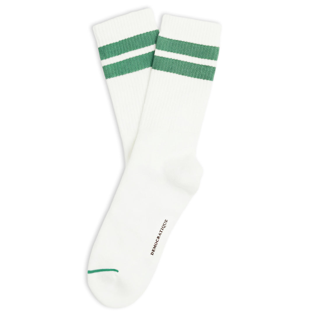 A pair of white crew socks with two green stripes near the cuff and a small green stripe on the toe, shown on a plain white background.